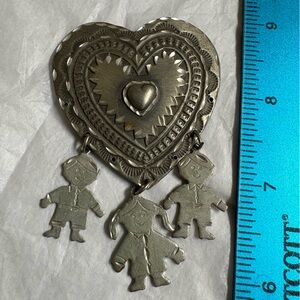 Silver Heart Pendant with Figures